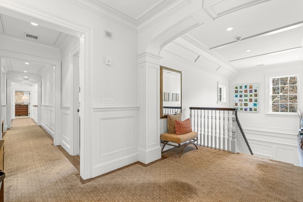 15 Valley Road Wellesley, MA 02481 - Photo 24 of 42 a view of a hallway with staircase and a living room