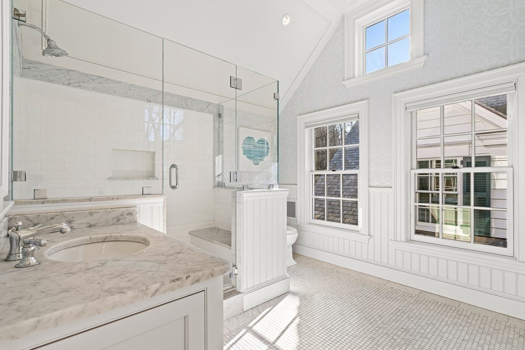 15 Valley Road Wellesley, MA 02481 - Photo 28 of 42 a bathroom with a granite countertop sink and a mirror