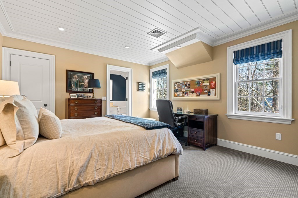 15 Valley Road Wellesley, MA 02481 - Photo 29 of 42 a bedroom with a bed and dresser with mirror