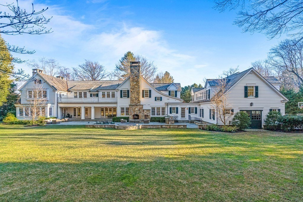 15 Valley Road Wellesley, MA 02481 - Photo 3 of 42 a front view of a house with a garden and trees