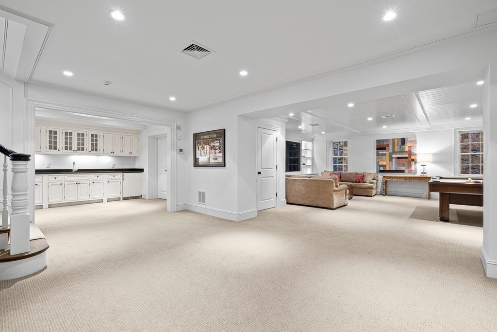 15 Valley Road Wellesley, MA 02481 - Photo 33 of 42 a large white room with kitchen view and living room