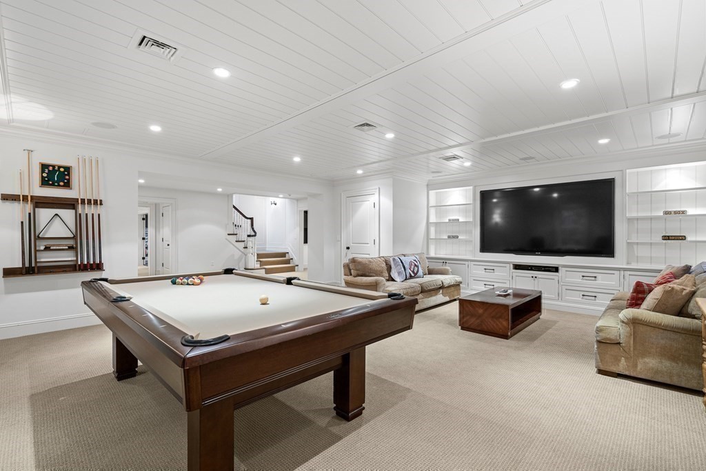 15 Valley Road Wellesley, MA 02481 - Photo 34 of 42 a living room with furniture and a flat screen tv