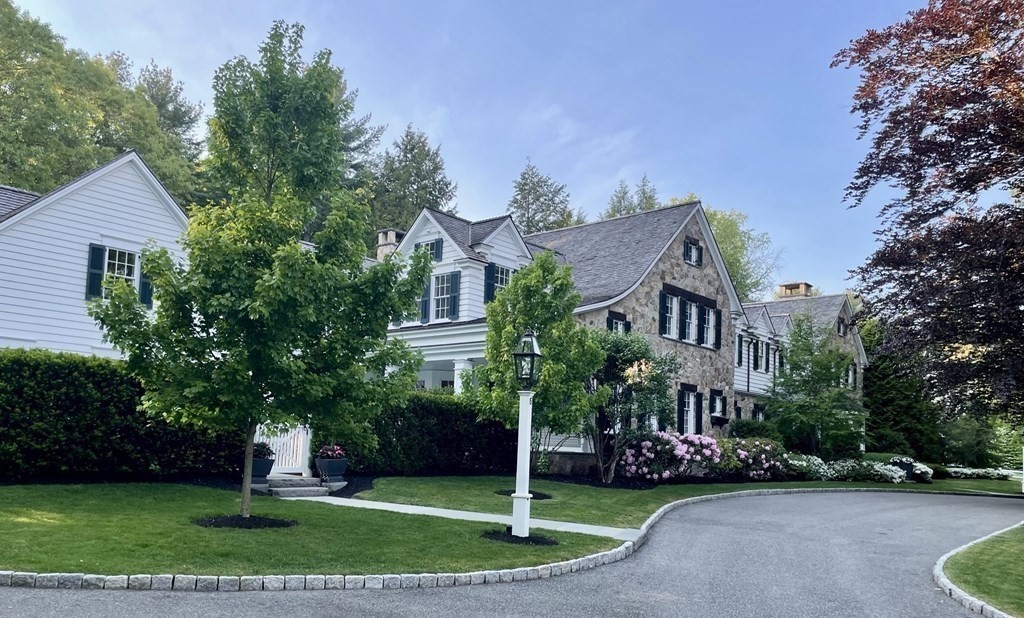 15 Valley Road Wellesley, MA 02481 - Photo 41 of 42 a view of a white house with a yard plants and trees