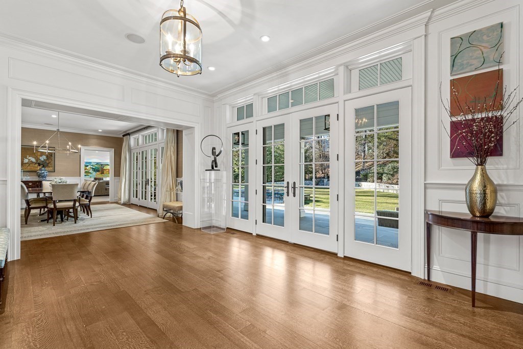 15 Valley Road Wellesley, MA 02481 - Photo 7 of 42 a view of a livingroom with furniture wooden floor and windows