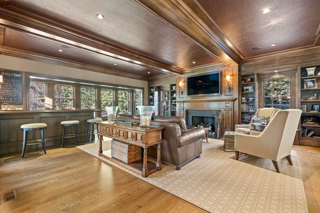 15 Valley Road Wellesley, MA 02481 - Photo 10 of 42 a living room with furniture a flat screen tv and a fireplace