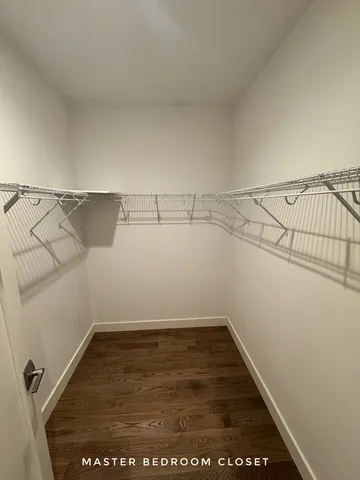 an empty room with racks on the wall
