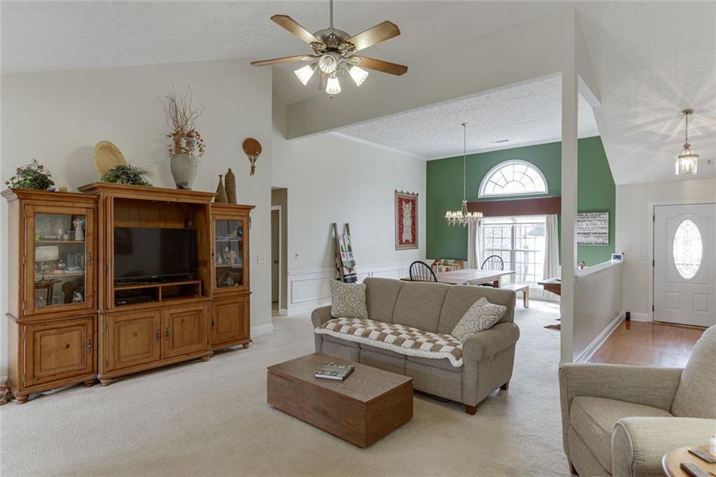 124 Edgewater Court Braselton, GA 30517 - Photo 11 of 54 a living room with furniture and a flat screen tv