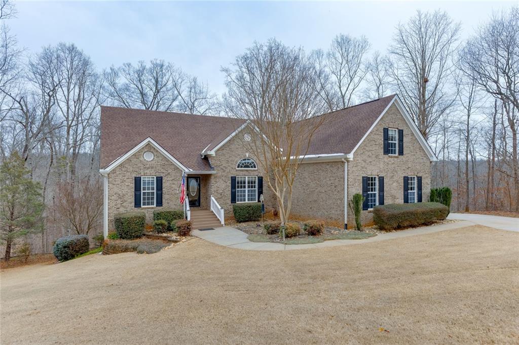 124 Edgewater Court Braselton, GA 30517 - Photo 2 of 54 a view of a house with a yard covered in snow