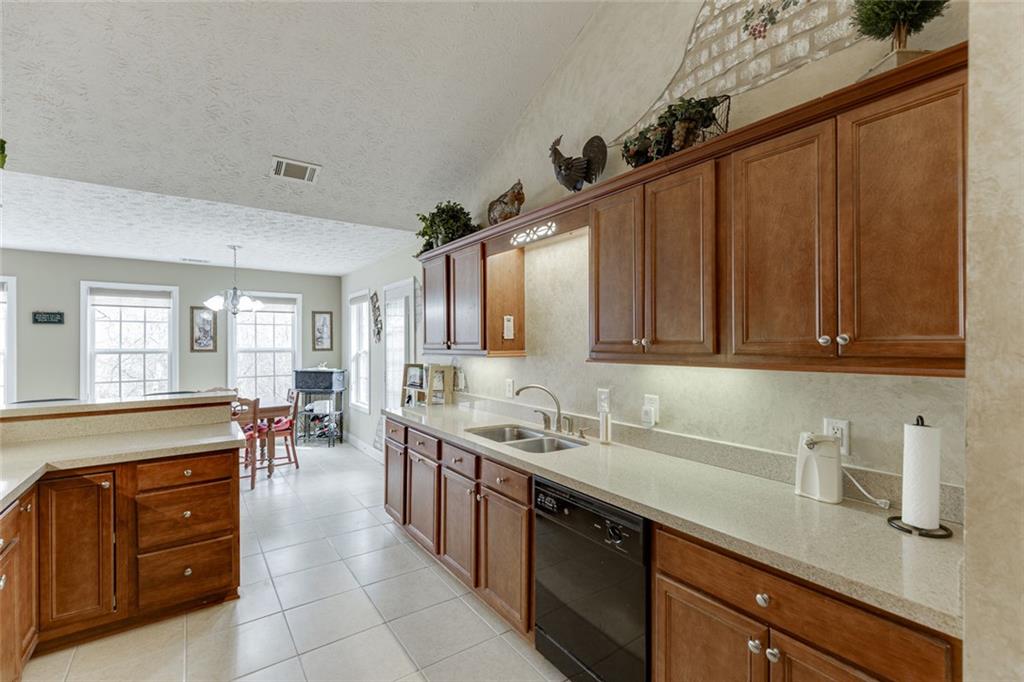 124 Edgewater Court Braselton, GA 30517 - Photo 23 of 54 a kitchen with a sink and cabinets