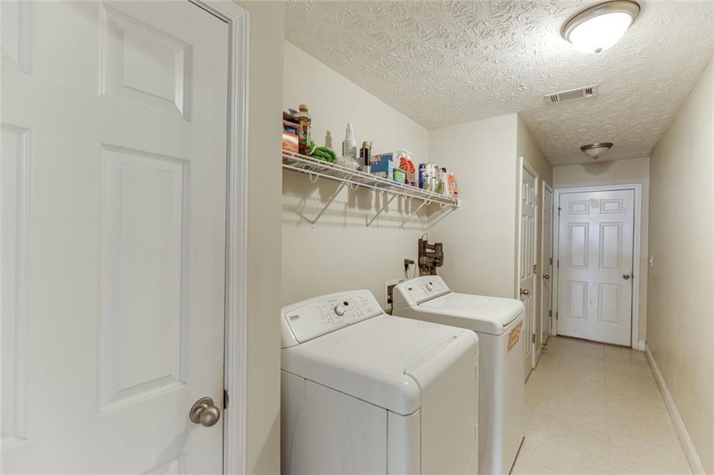 124 Edgewater Court Braselton, GA 30517 - Photo 24 of 54 a utility room with dryer and washer