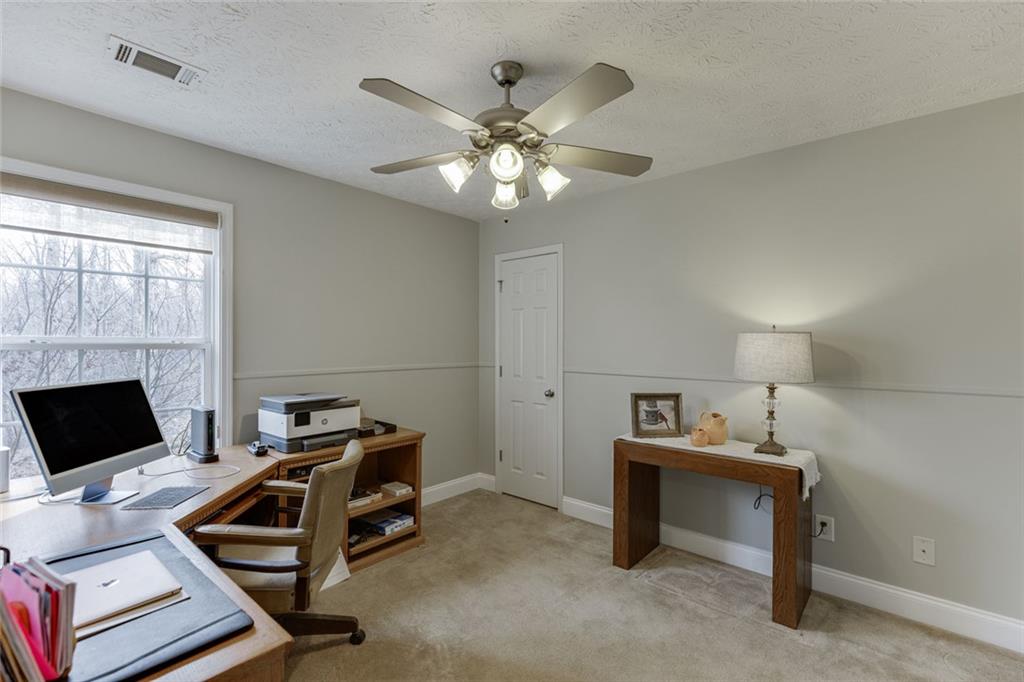 124 Edgewater Court Braselton, GA 30517 - Photo 28 of 54 a bedroom with bed and a window