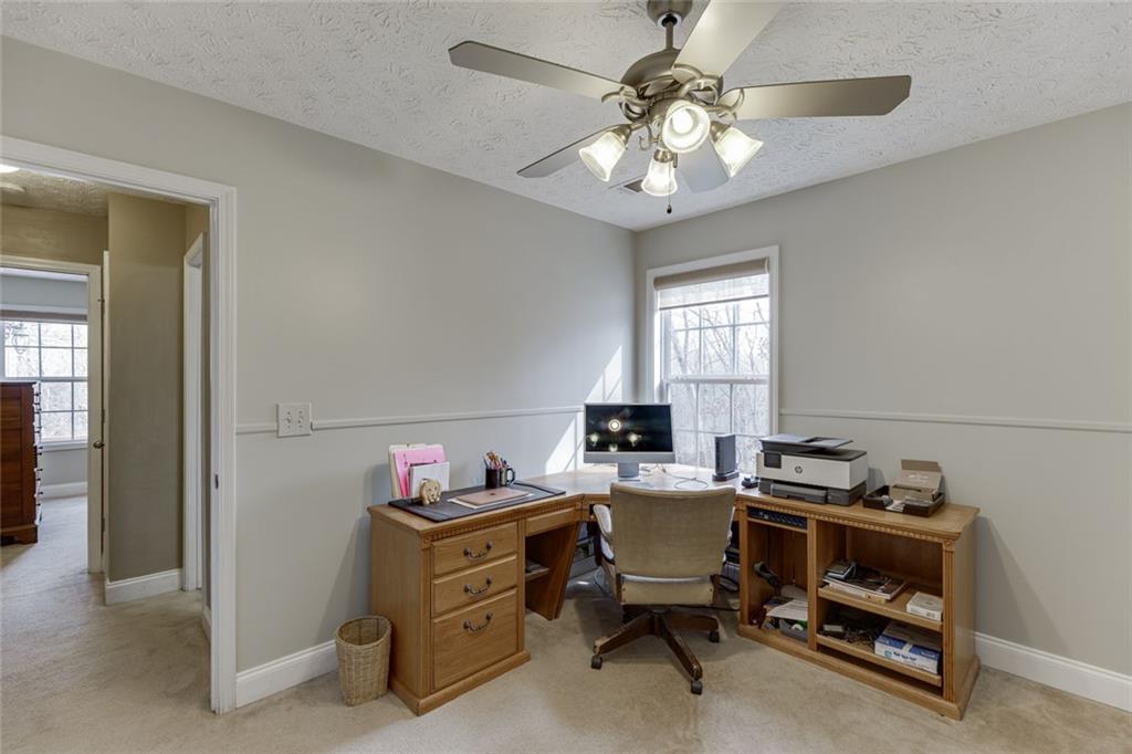 124 Edgewater Court Braselton, GA 30517 - Photo 29 of 54 a room with a workspace