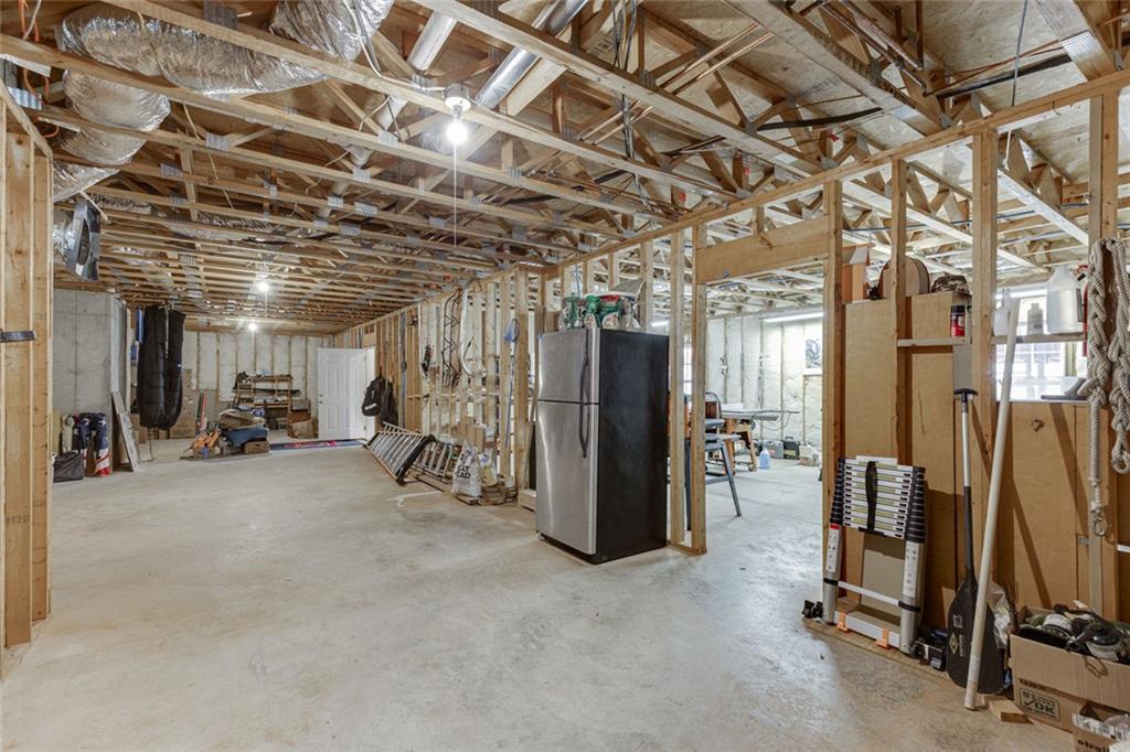 124 Edgewater Court Braselton, GA 30517 - Photo 41 of 54 a view of a room with gym equipment