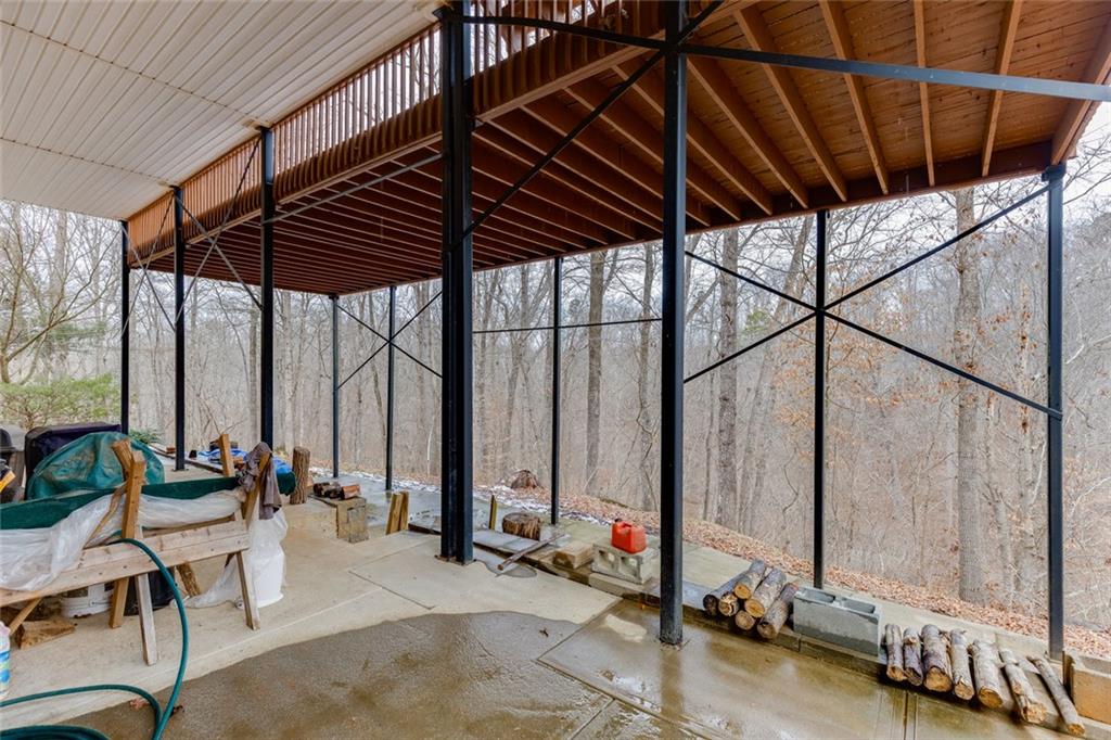 124 Edgewater Court Braselton, GA 30517 - Photo 49 of 54 deck with table and chairs and potted plants