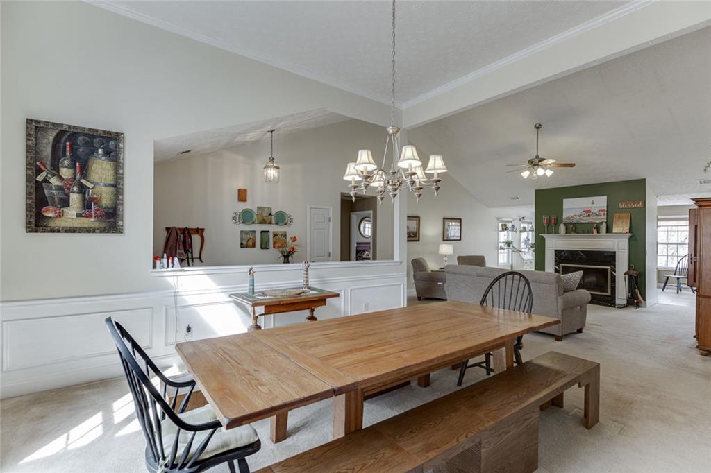 124 Edgewater Court Braselton, GA 30517 - Photo 7 of 54 a dining room with furniture a chandelier and window