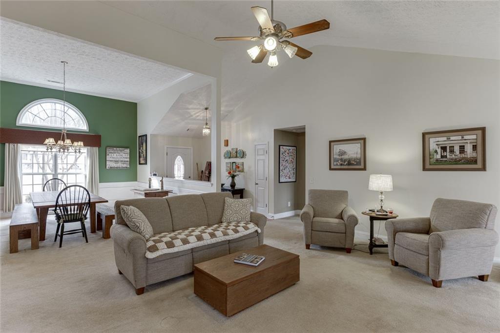 124 Edgewater Court Braselton, GA 30517 - Photo 10 of 54 a living room with furniture and a large window