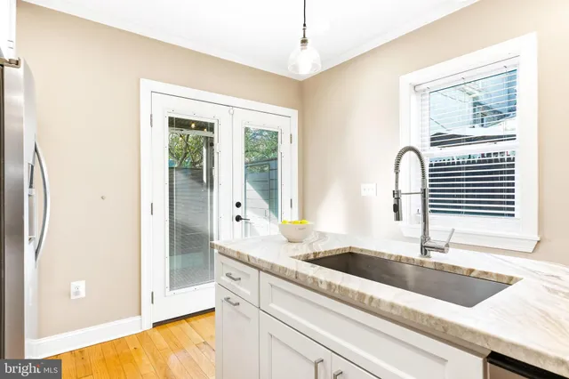 a kitchen with stainless steel appliances granite countertop a stove and a microwave