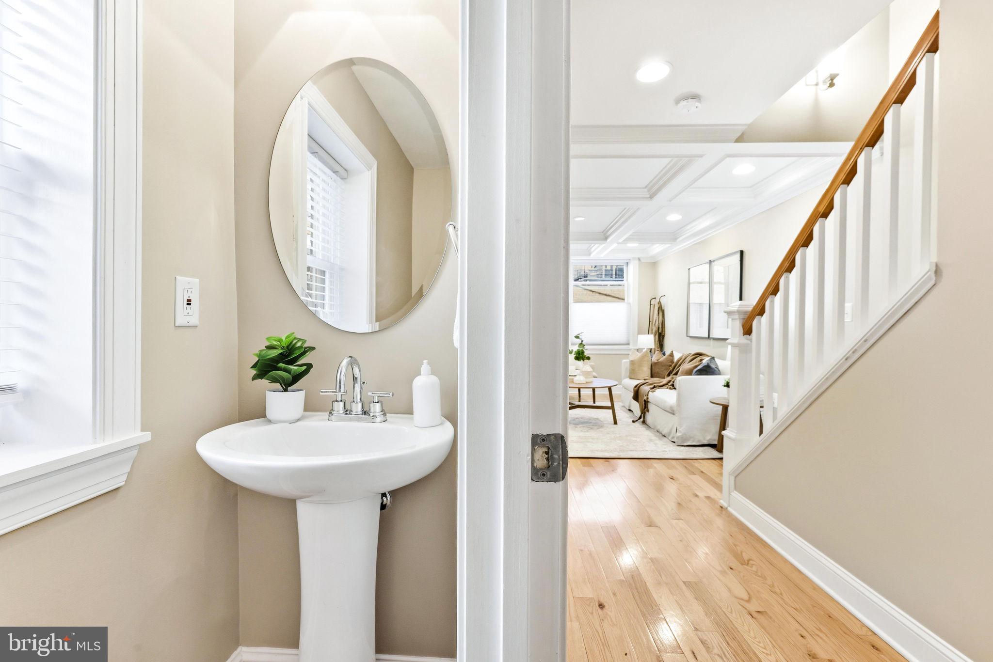 404 South Castle Street Baltimore, MD 21231 - Photo 20 of 47 a bathroom with a sink and a mirror
