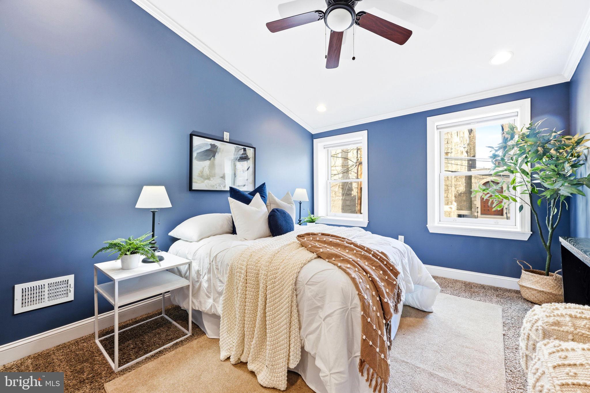 404 South Castle Street Baltimore, MD 21231 - Photo 24 of 47 a bedroom with a bed and a chandelier