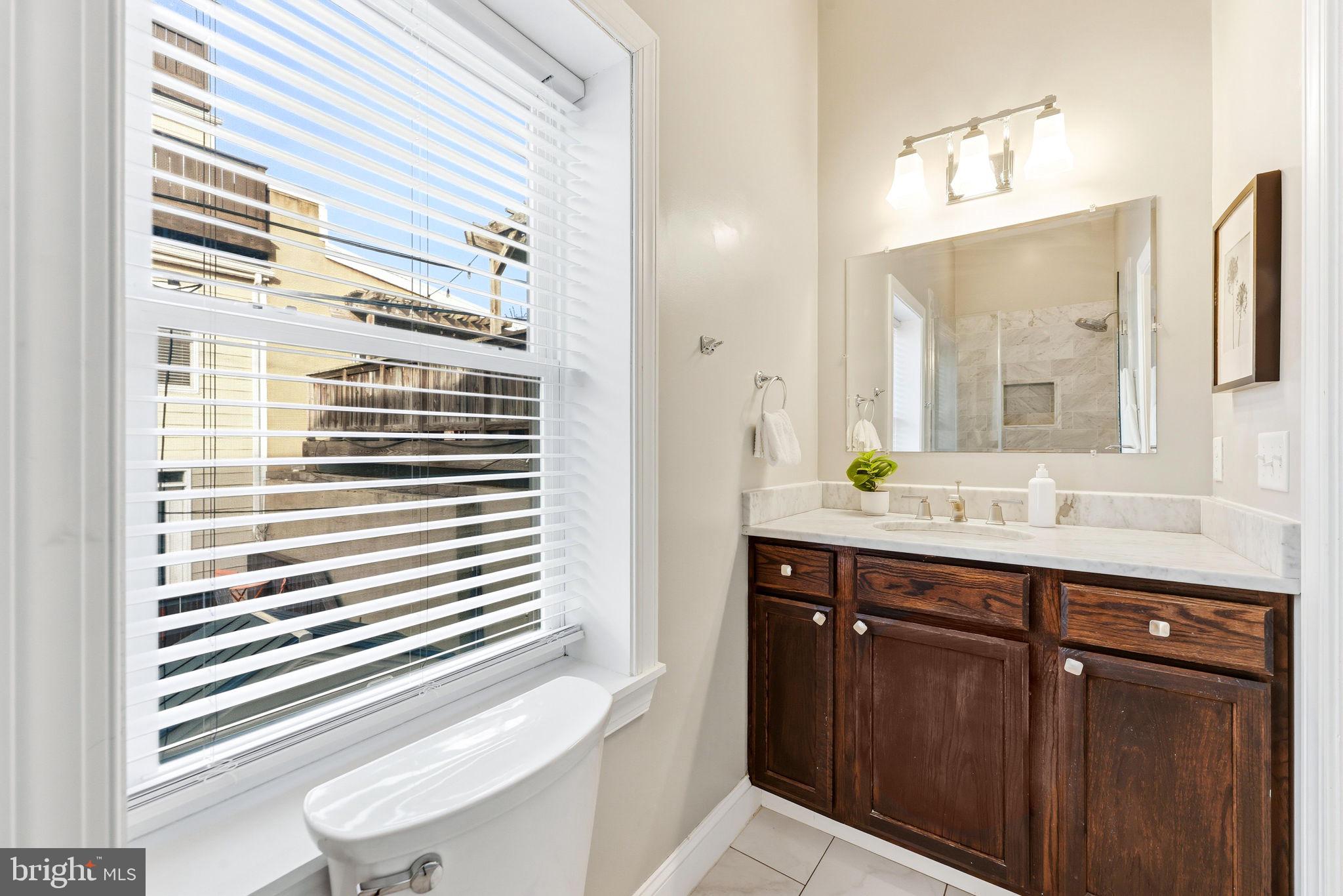 404 South Castle Street Baltimore, MD 21231 - Photo 28 of 47 a bathroom with a sink and a mirror