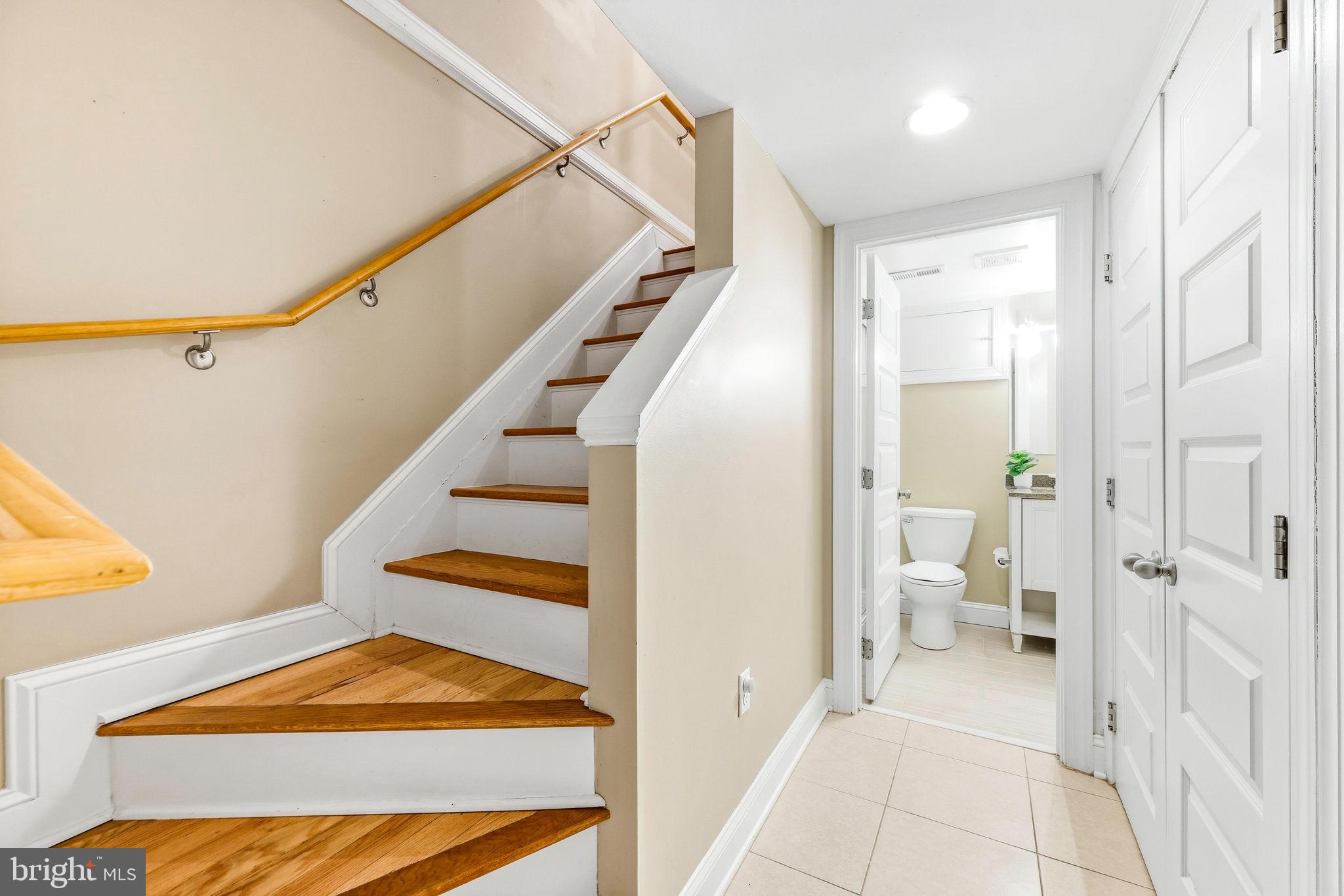 404 South Castle Street Baltimore, MD 21231 - Photo 35 of 47 a view of a hallway with wooden floor and a bathroom