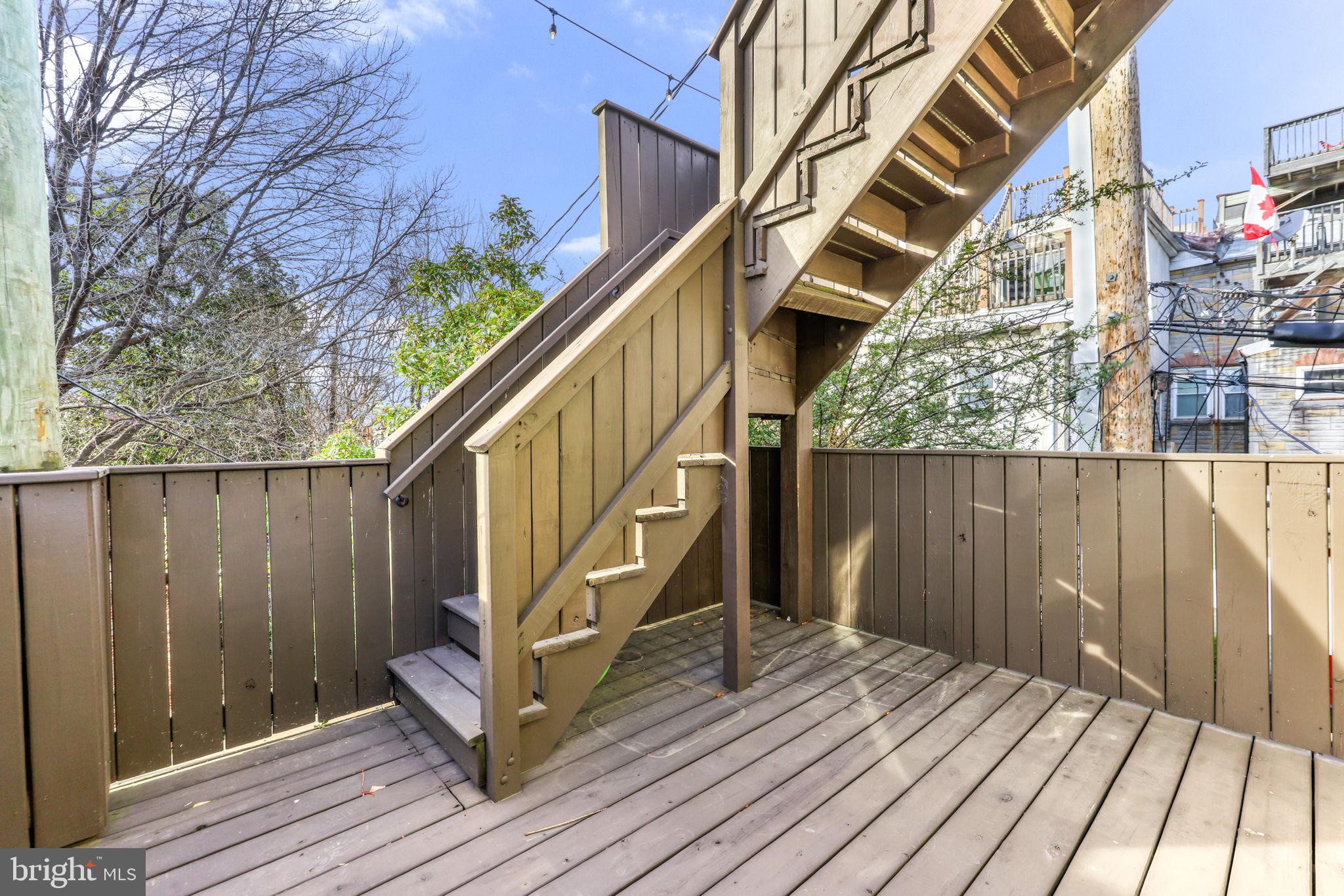 404 South Castle Street Baltimore, MD 21231 - Photo 40 of 47 a view of entryway with wooden floor and stairs