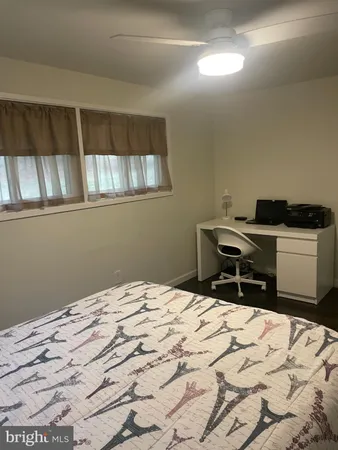 a bedroom with a bed and a table in it