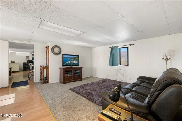 a kitchen with a sink a stove a refrigerator and white cabinets
