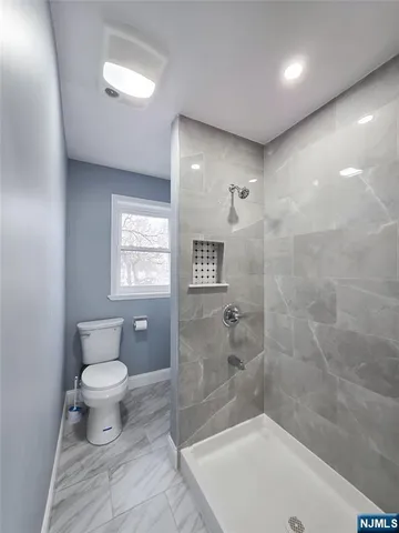 a bathroom with a toilet a sink and a bathtub