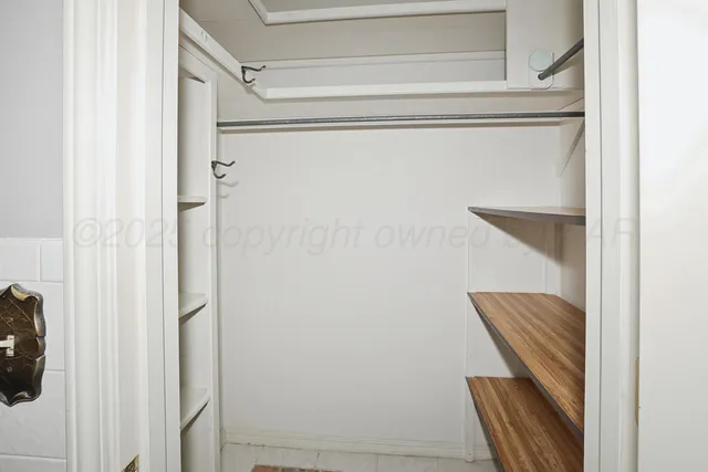 a view of staircase with wooden floor