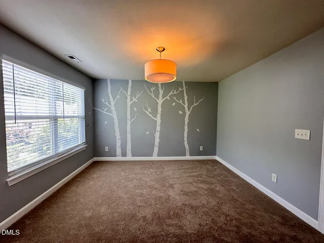 a view of a room with a chandeliers