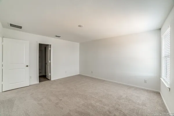 a view of an empty room and closet