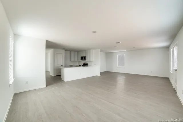 a view of a kitchen with a sink cabinets and a window