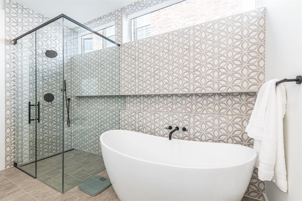 4202 Bonham Street Dallas, TX 75229 - Photo 17 of 32 Full bath featuring a soaking tub and a shower stall