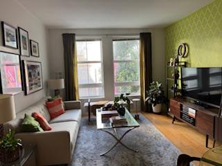 821 Folsom Street, Unit 217 San Francisco, CA 94107 - Photo 1 of 15 a living room with furniture a flat screen tv and a window