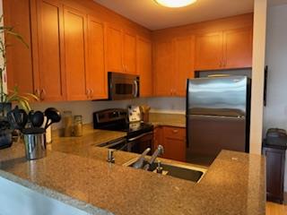 821 Folsom Street, Unit 217 San Francisco, CA 94107 - Photo 4 of 15 a kitchen with a refrigerator a stove and a sink with wooden floor