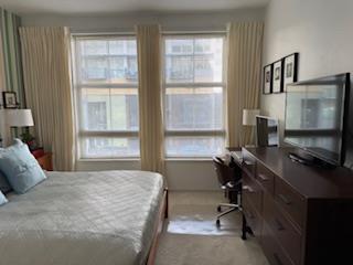 821 Folsom Street, Unit 217 San Francisco, CA 94107 - Photo 9 of 15 a bedroom with a bed and a window