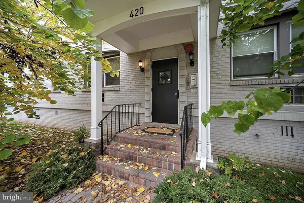 a kitchen with a refrigerator a washer and dryer