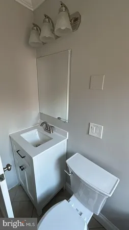 a bathroom with a tub and toilet