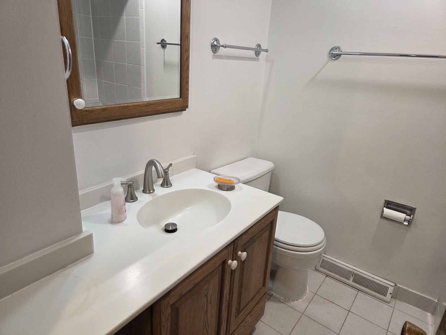 528 East Main Street Barrington, IL 60010 - Photo 13 of 18 a bathroom with a sink a toilet and mirror