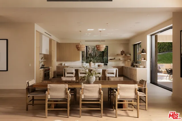 a living room with fireplace furniture and a potted plant