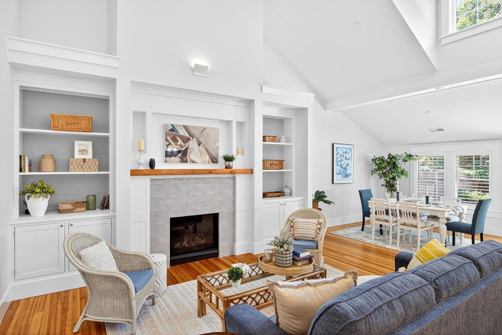 950 Massasoit Road, Unit 3 Eastham, MA 02642 - Photo 18 of 42 a living room with furniture and a fireplace