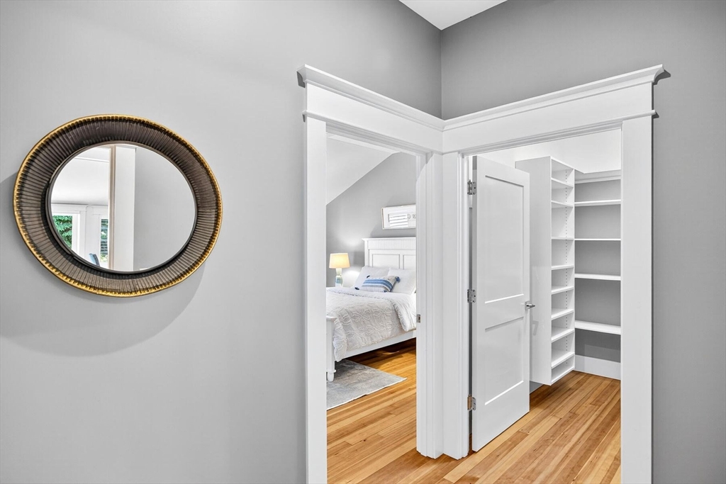 950 Massasoit Road, Unit 3 Eastham, MA 02642 - Photo 29 of 42 a view of a hallway with bathroom and wooden floor