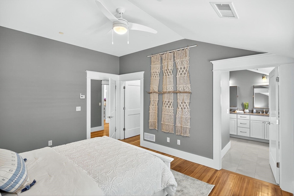 950 Massasoit Road, Unit 3 Eastham, MA 02642 - Photo 31 of 42 a spacious bedroom with a bed and a view of bathroom