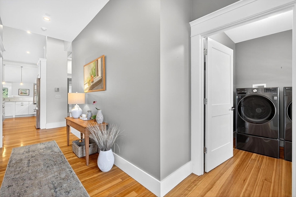 950 Massasoit Road, Unit 3 Eastham, MA 02642 - Photo 8 of 42 a hallway with a dining table & chairs in it