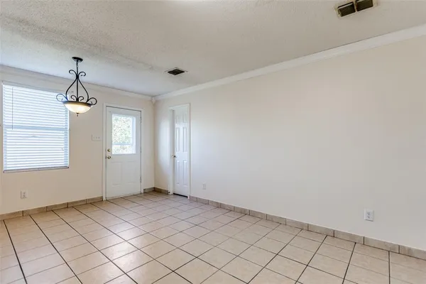 a view of an empty room and window