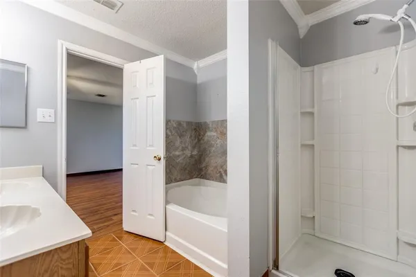 a bathroom with a bathtub and a shower