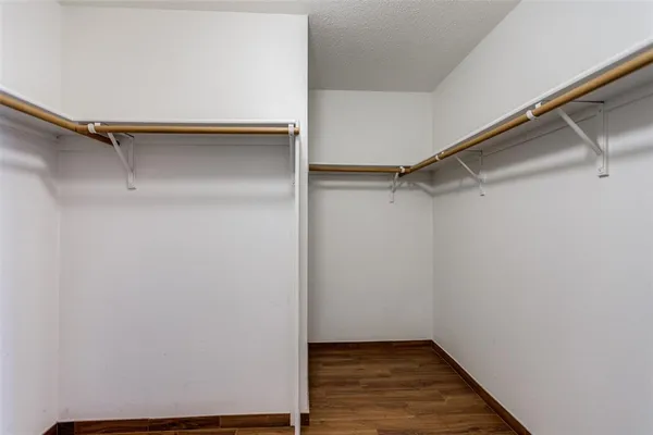a view of an empty walk in closet