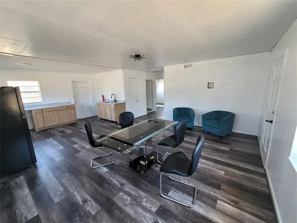 a workspace with furniture and wooden floor
