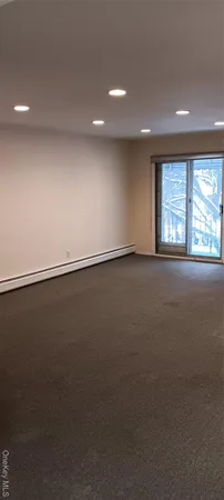 an empty room with a empty space and a window